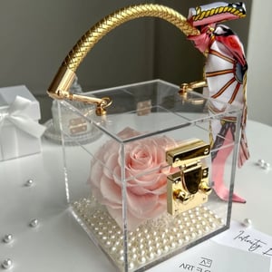 Everlasting Pink Rose in an acrylic cube.