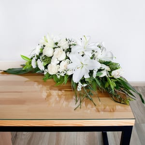 White condolences: roses and lilies