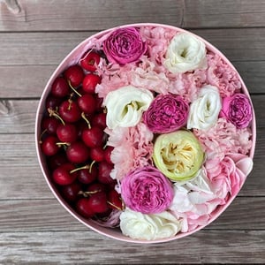 Flowers with cherries in a box