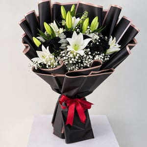 black roses lilies bouquet