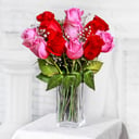 A bouquet of 11 red and pink roses