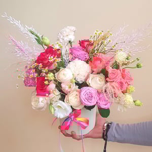 Mixed bouquet with roses in a box