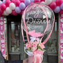 Box with roses and a balloon with an inscription