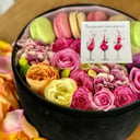Flowers and macaroon in a box