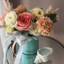 Floral arrangement and candle