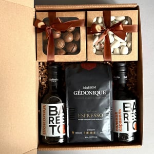 Gift set with coffee, syrup, and nuts.
