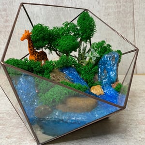 Florarium with waterfalls and giraffe