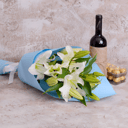 Сandlelit dinner: Two lilies, wine and a box of chocolates