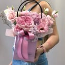 Bright arrangement in flower bag