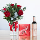 Red roses with chocolate and a drink