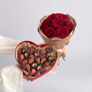 Strawberries dipped in milk chocolate with roses