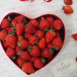 Heart with fresh strawberries in a box