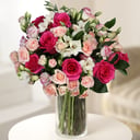 A bouquet of roses and lisianthus