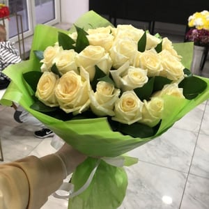 Bouquet of white roses with greenery