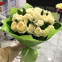 Bouquet of white roses with greenery