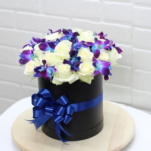 Ramo de orquídeas en caja