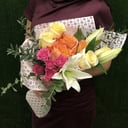 Non-classical bouquet with lilies and roses