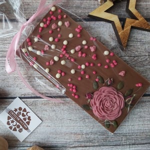 Handmade chocolate with flower and crispy