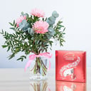 Pink gerberas and chocolate