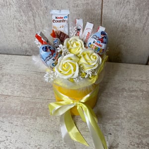 Box with sweets and soap roses