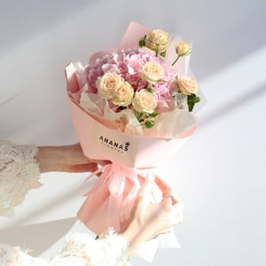 Designer bouquet featuring hydrangeas and roses