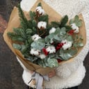Winter bouquet with cotton and ilex