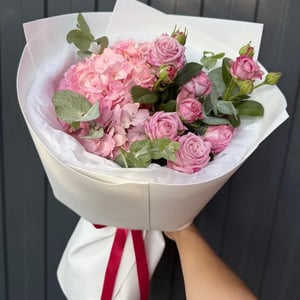 A hydrangea and shrub-rose bouquet