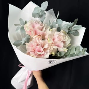 A bouquet of three French roses.