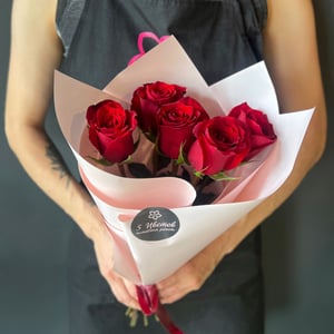 A bouquet of five red roses
