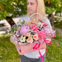 Fresh assorted flowers in a handbag