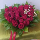 Composition of red roses in a box of hearts