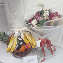 Gift with fruits and flowers