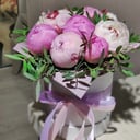 9 pink peonies with greenery in a box