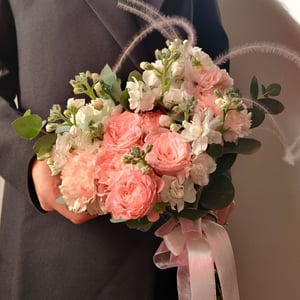 Bridal bouquet of roses and stock