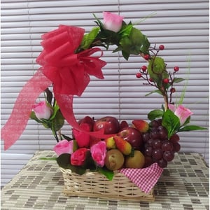 Basket of artificial fruits and flowers