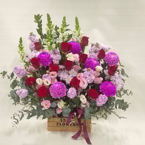 Flower box 'A charming floral arrangement in a wooden box.'