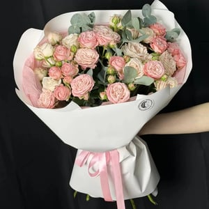 Bouquet of seven shrub roses and eucalyptus.