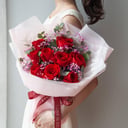 Bouquet of red roses with gypsophila