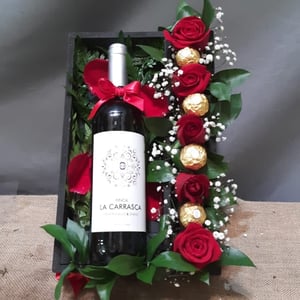 Box of roses, wine, and chocolates