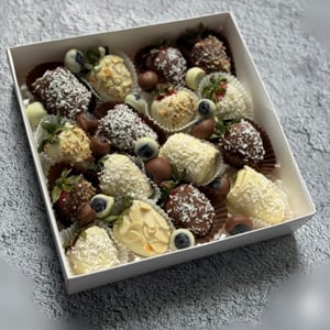 Blueberries, strawberries, and bananas in chocolate