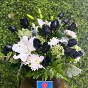 Bouquet of black roses and lilies