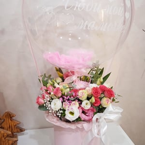 Box with flowers and bubbles balloon