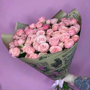 Bouquet 'Bombastic shrub roses in kraft paper.'